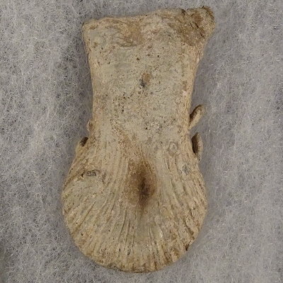 Pilgrim's Ampulla found in Norfolk, showing scallop shell design.