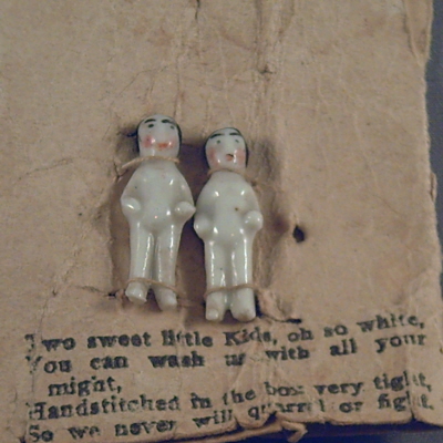 Porcelain pudding dolls on their card