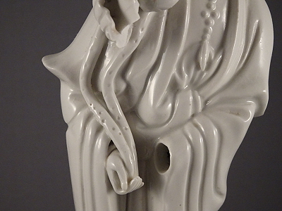 Figure of Guanyin (porcelain): note missing hand, which was designed to be removed.